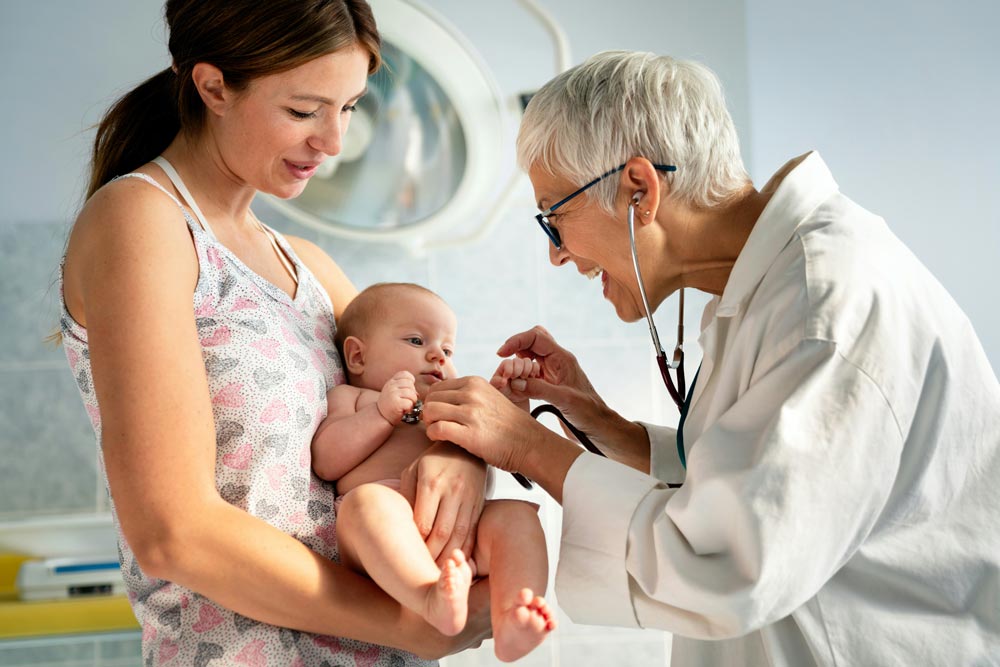 mom with baby and pediatricians in bend