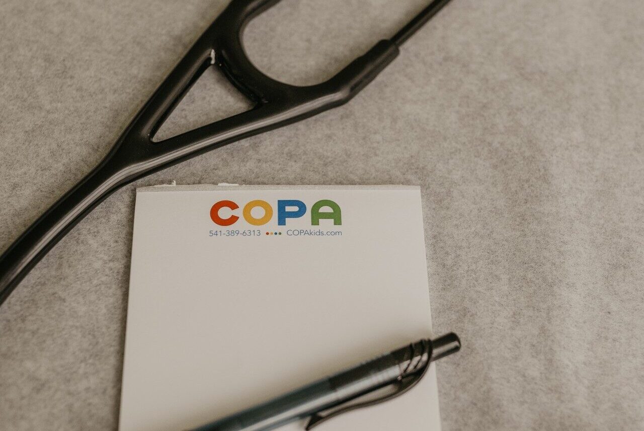 COPA notepad with stethoscope next to it.