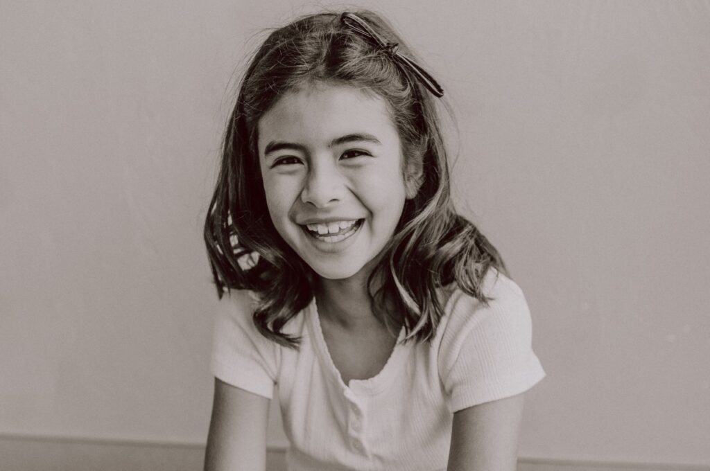 Child smiling at pediatrician.