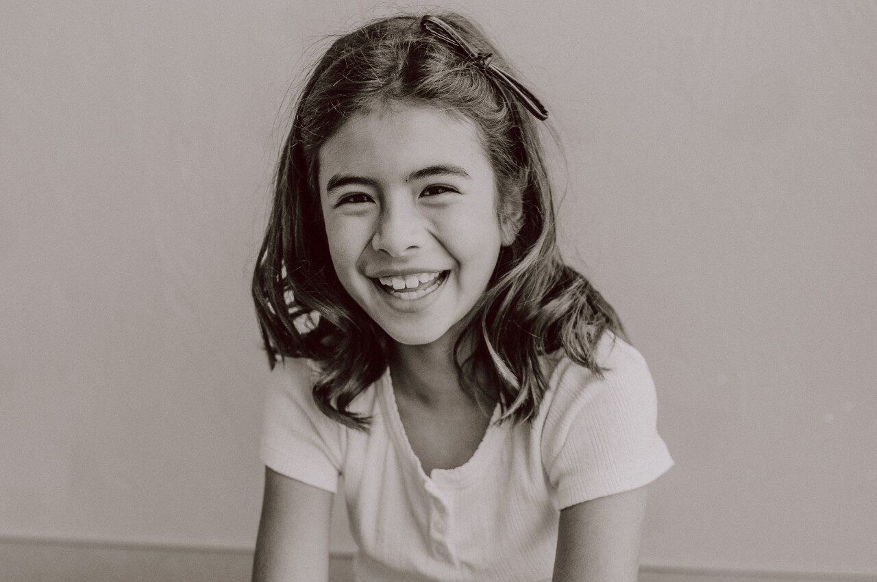 Child smiling at pediatrician.